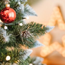 Snow Covered Christmas tree, with real natural cones, white snow, and silver crystals